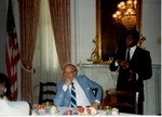 Mickey Leland with boxing champion Sugar Ray Leonard ; Jim Wright ; Unknown others ; at dinner in the Capitol by The Mickey Leland Papers & Collection Addendum. (Texas Southern University, 2018)