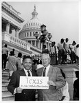 Mickey Leland with Ralph Hall and a "Texas: It's Like a Whole Country' sign by The Mickey Leland Papers & Collection Addendum. (Texas Southern University, 2018)