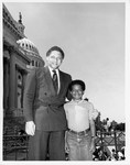 Mickey Leland with boy on capitol steps by The Mickey Leland Papers & Collection Addendum. (Texas Southern University, 2018)
