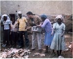 Assisting Ethiopian Jews constructing a building. Ethiopia. Summer, 1987 by The Mickey Leland Papers & Collection Addendum. (Texas Southern University, 2018)