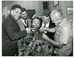 Enjoying an "April Fools" joke with the members of the "Bearded Caucus" by The Mickey Leland Papers & Collection Addendum. (Texas Southern University, 2018)