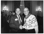 Mickey Leland shaking hands with Jim Wright. Signed picture by The Mickey Leland Papers & Collection Addendum. (Texas Southern University, 2018)